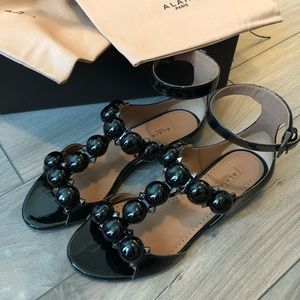 Alaia Bombe patent leather sandal